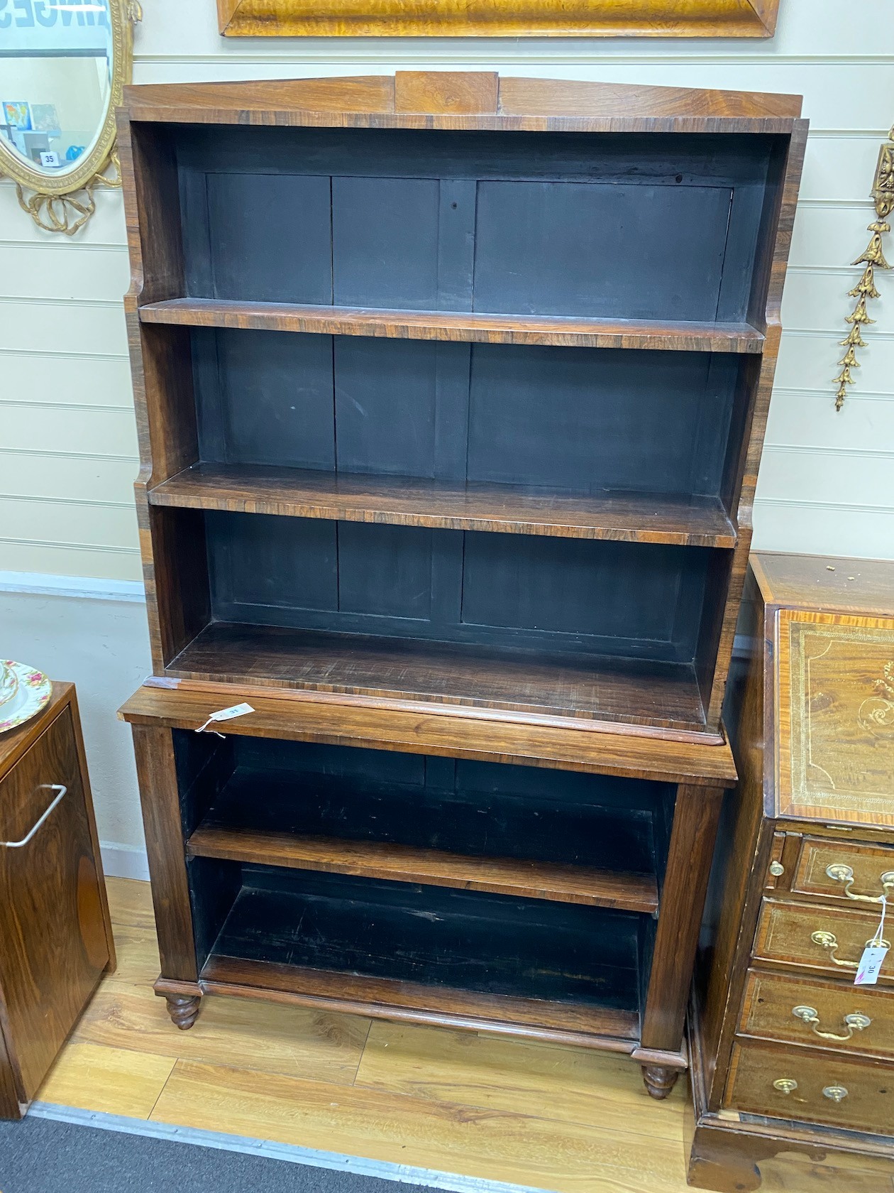 An early Victorian rosewood open bookcase, width 107cm, depth 35cm, height 178cm